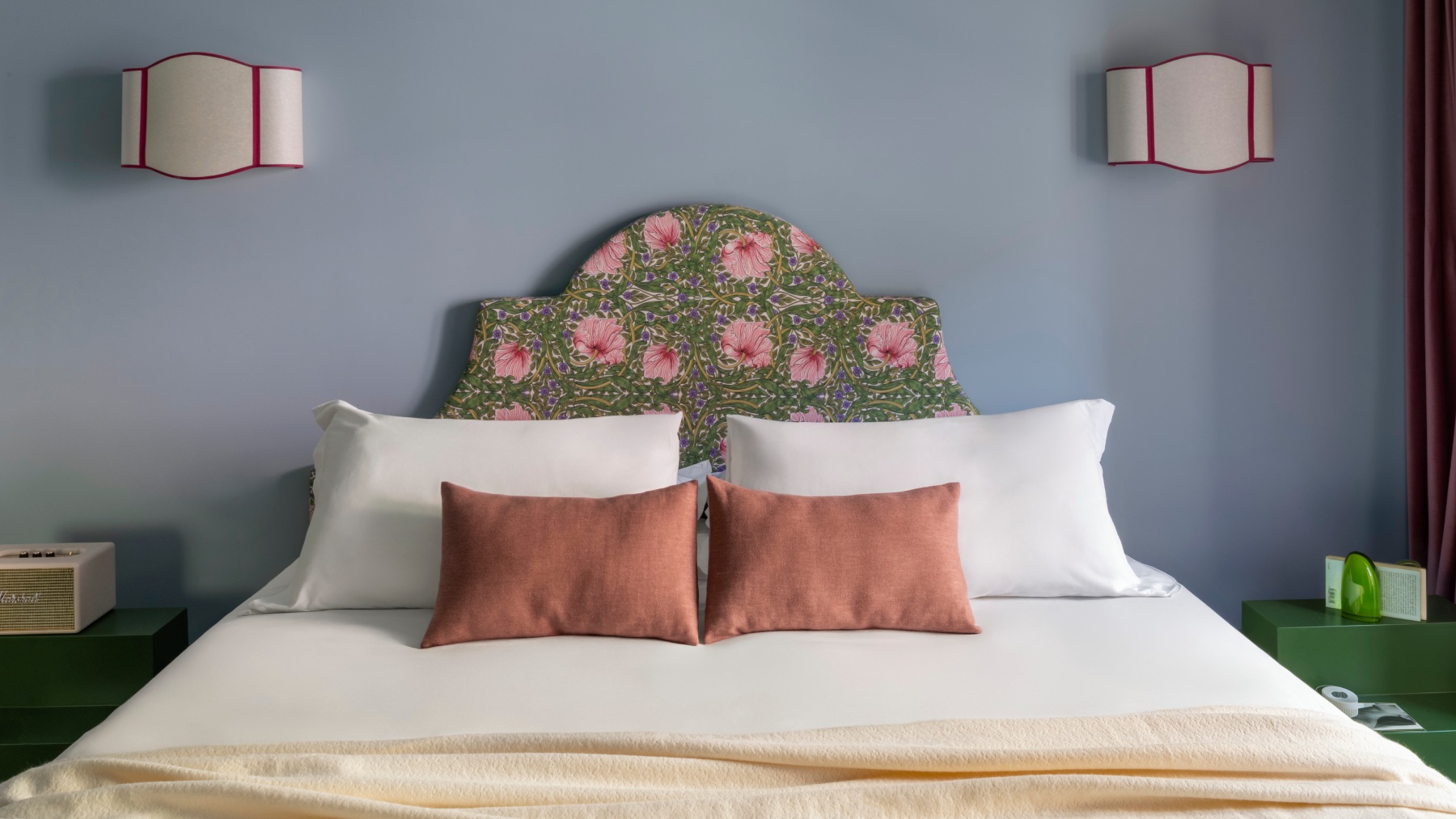 Double bed detail with decorative cushions and floral headboard in design hotel – The 4 Rooms, BZAR hotels in Rome