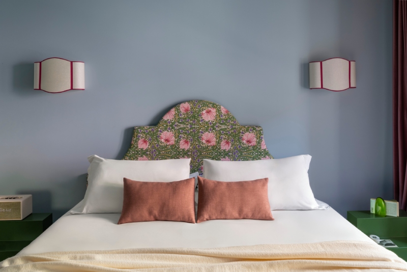 Deluxe room bed detail with floral headboard and design furnishings – The 4 Rooms, BZAR hotels in Rome